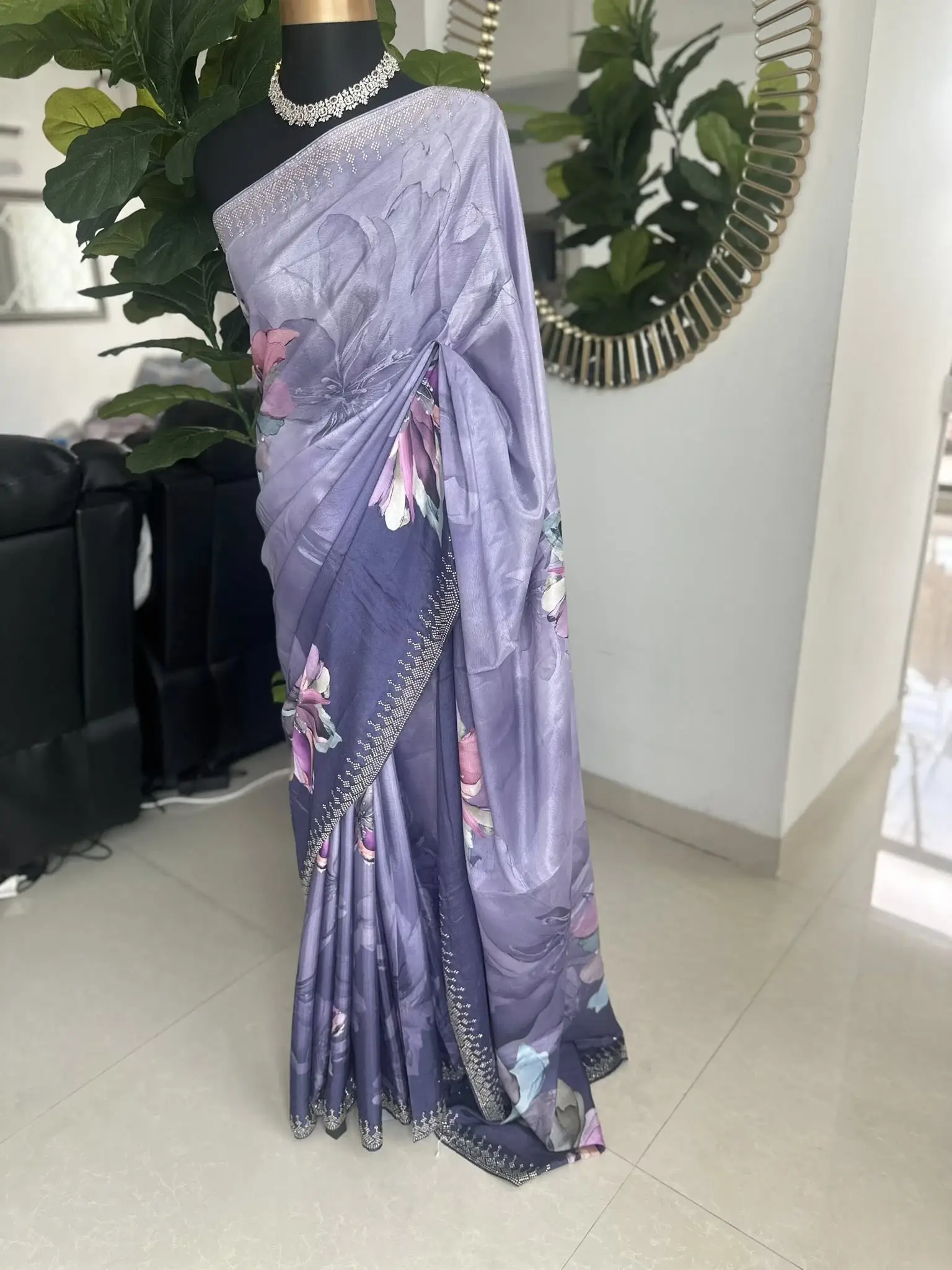 Purple-toned floral-printed saree with stonework.