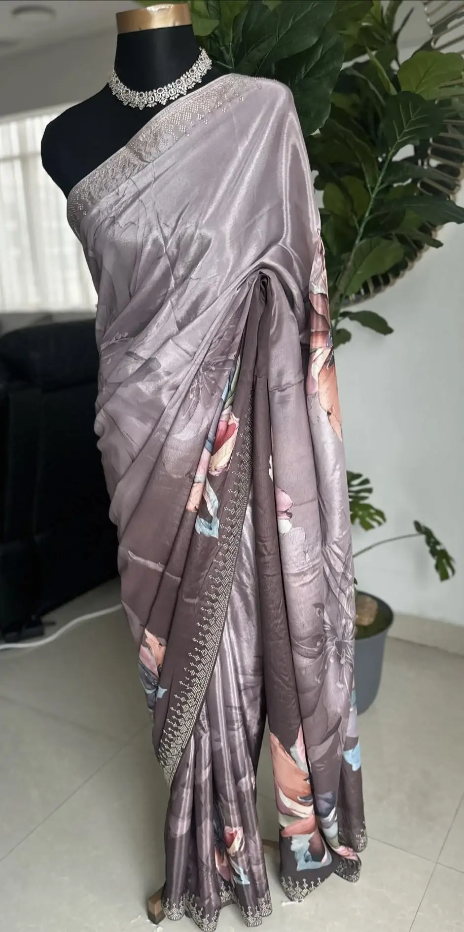 Grey floral printed saree with stonework.