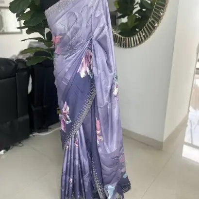 Purple-toned floral-printed saree with stonework.