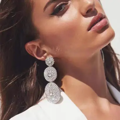 Silver-toned, three-tiered drop earrings with details