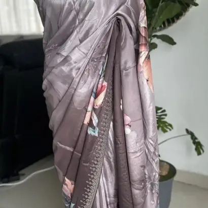 Grey floral printed saree with stonework.