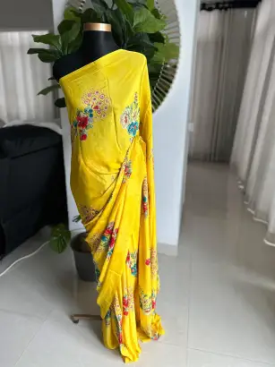 Bright yellow floral print satin silk saree