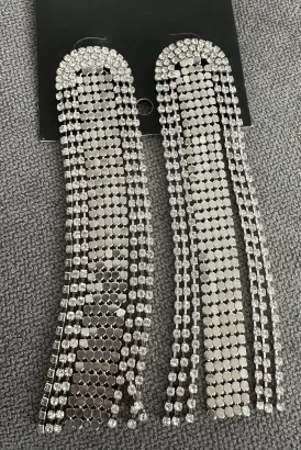 Silver-toned rhinestone waterfall earrings.