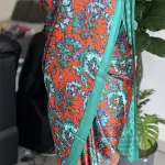 Orange & green contemporary printed satin crepe saree