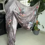 Grey floral printed saree with stonework.
