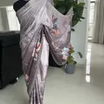 Grey floral printed saree with stonework.