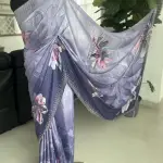 Purple-toned floral-printed saree with stonework.