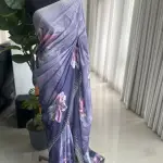 Purple-toned floral-printed saree with stonework.